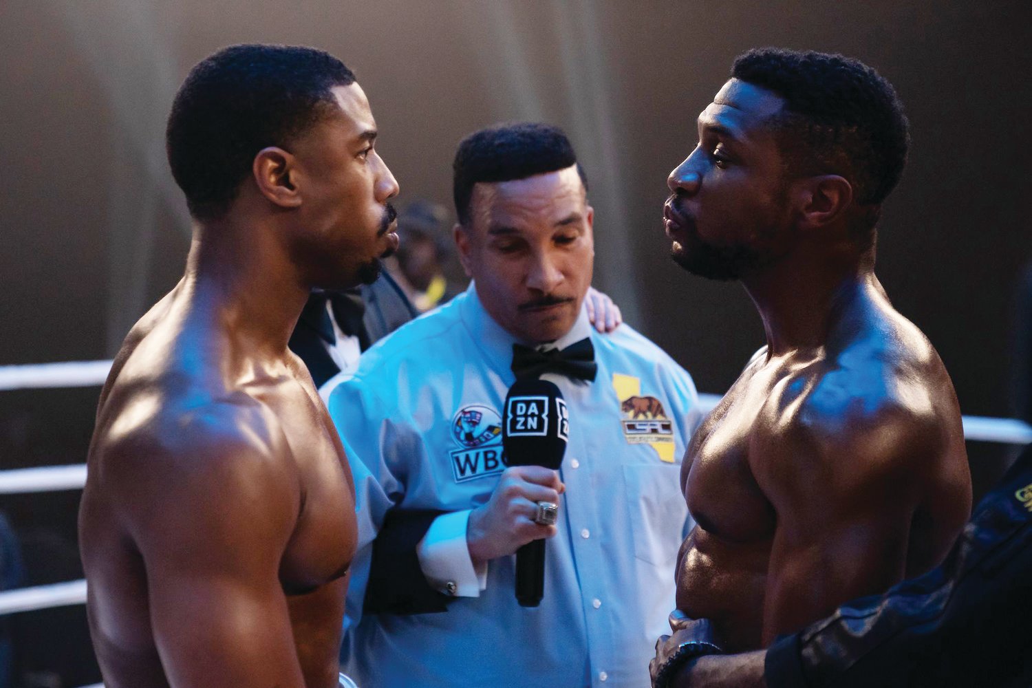 Michael B. Jordan (left) directed as well as stars in "Creed III," in which he squares off with Jonathan Majors (right.